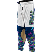 White motocross pants with navy blue knee panels, a beige abrasion patch, and vibrant multicolor psychedelic patterns on the lower legs and side.