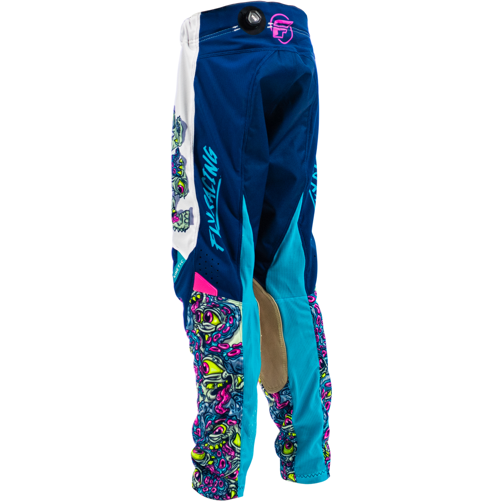 Blue motocross pants with white side panels, turquoise knee panels, and colorful psychedelic graphic patterns on the lower legs, shown on a white background.