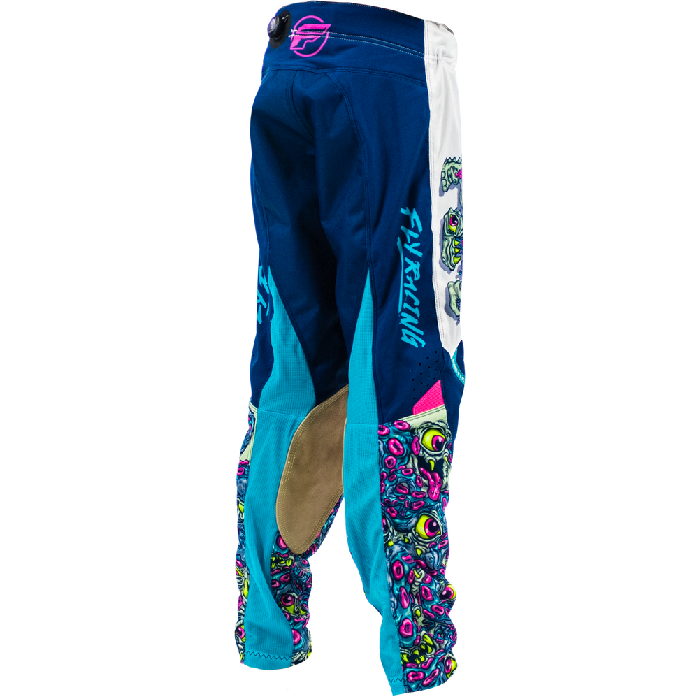 Blue motocross pants with turquoise panels, a white side stripe, and colorful psychedelic graphics near the lower legs, shown on a white background.