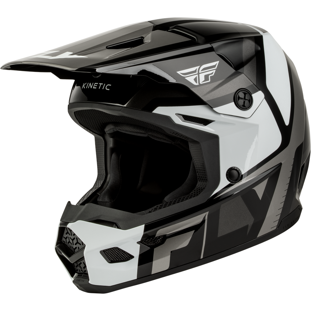 A Fly Racing full-face motocross helmet in a glossy black, white, and gray color scheme, featuring the Fly logo on the side and visor, and 'KINETIC' text on the brow, set against a plain white background.