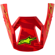 A red Alpinestars motocross helmet peak visor with a glossy finish, featuring yellow star graphics on the sides and a yellow Alpinestars logo on the front, set against a plain white background.