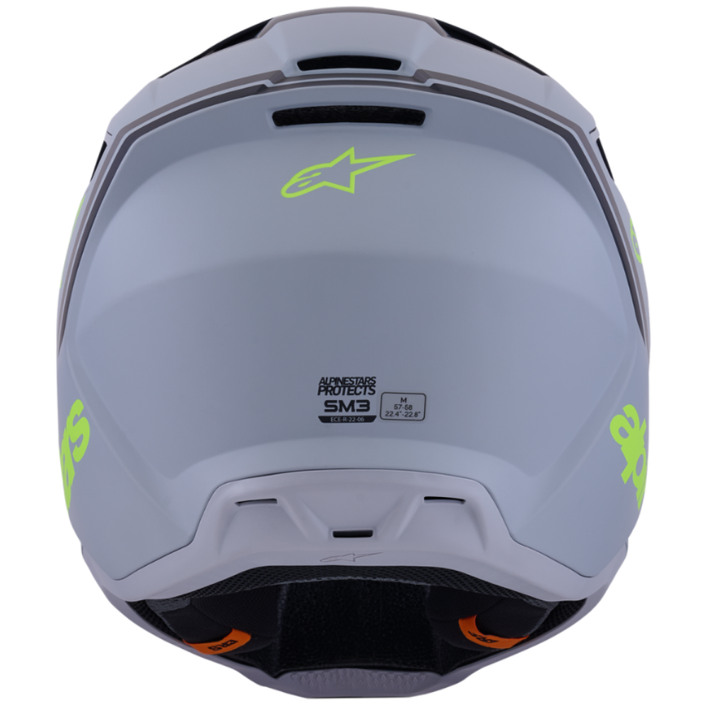Gray motorcycle helmet with green accents on a white background