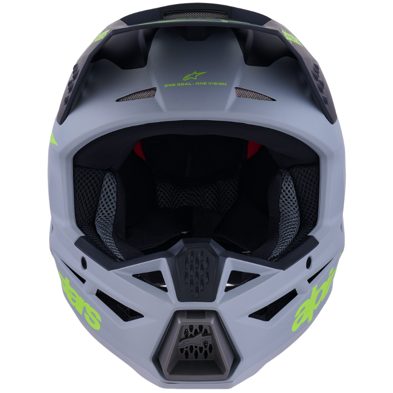 Gray helmet with green accents and 'Alpinestars' branding on a white background