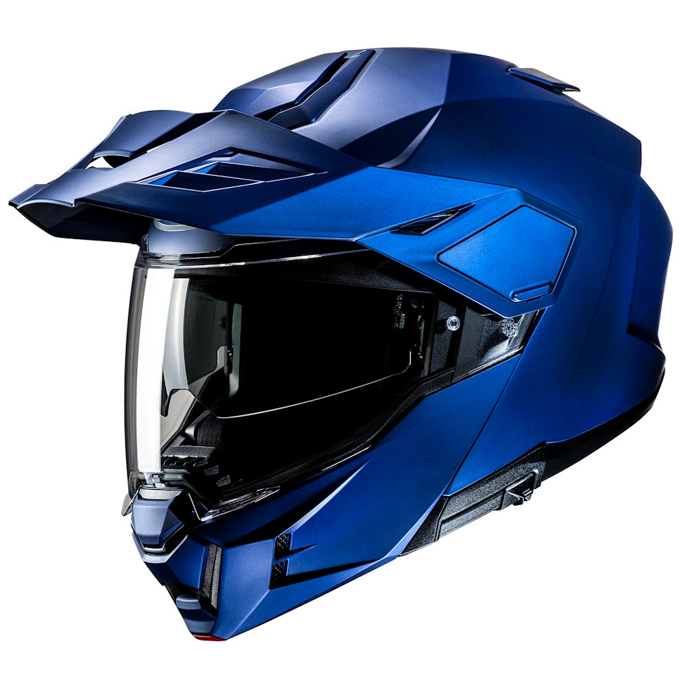 Blue motorcycle helmet with clear visor on a white background