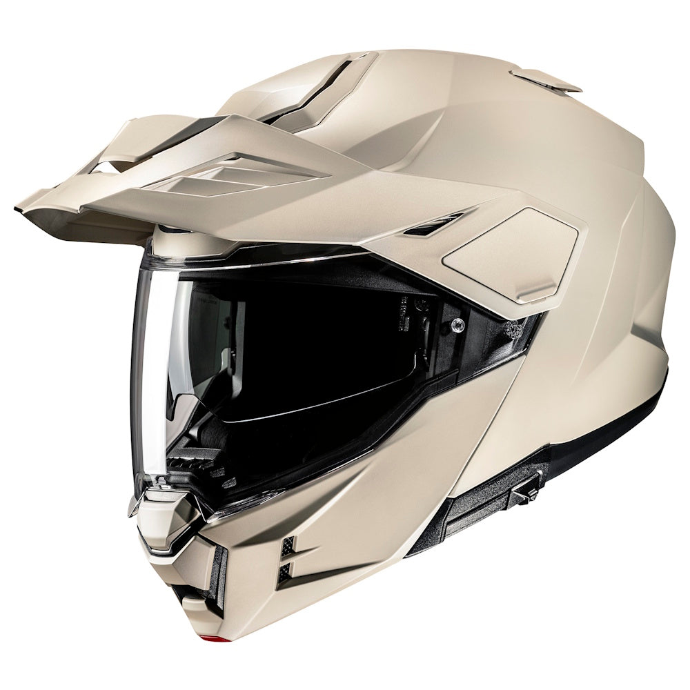 Sand color off-road helmet with clear visor on a white background