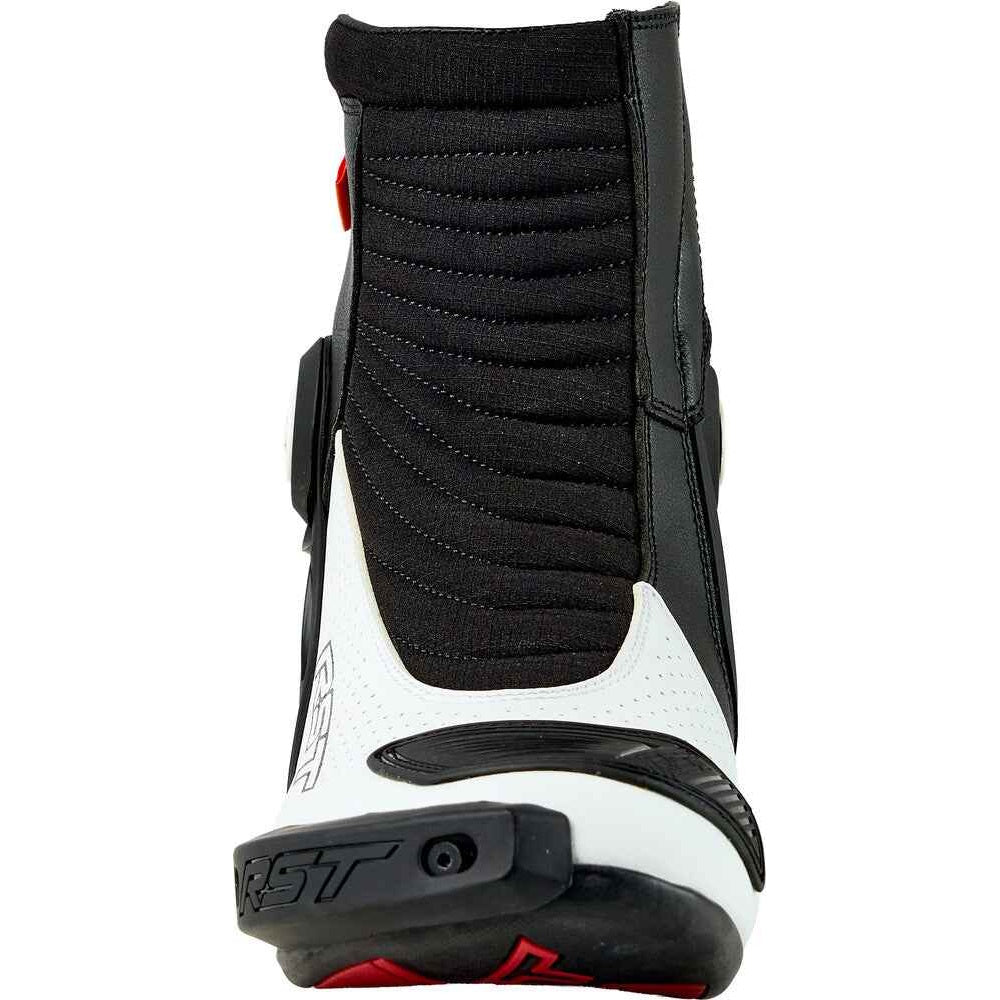 Black and white motorcycle boot with red accents on a white background