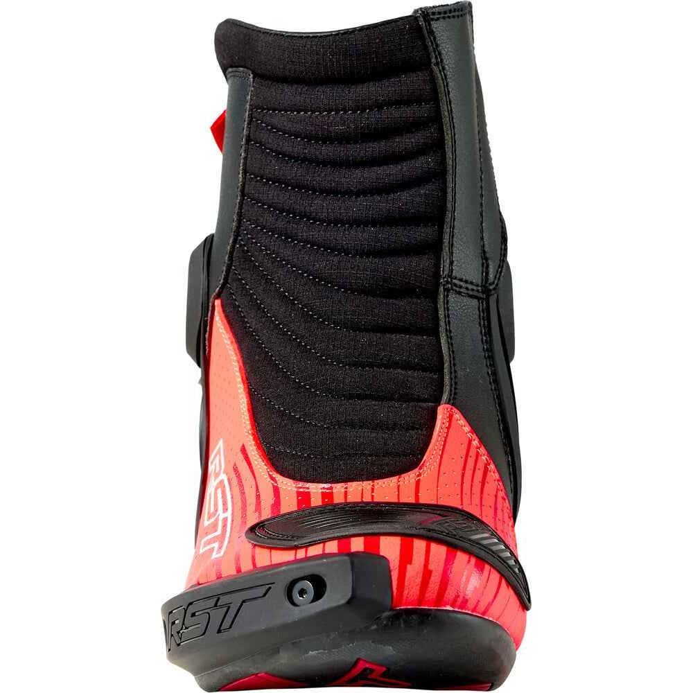 Red and black motorcycle boot with visible brand logo on a white background